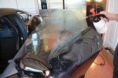 Final application of window film mix solution to remove any dirt or dust from the surfaces